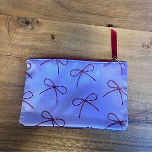 Purple Cosmetic Bag with Red Bow Design